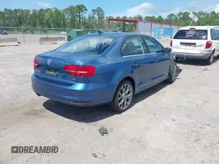 2015 Volkswagen Jetta Sport with VIN 3VWD17AJ9FM297822, listed as a IAAI auction lot 42621800 with 99,966 mi miles and . Bid and sale history available at DreamBid. Image 4.