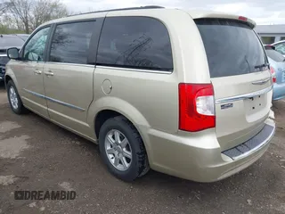 2011 Chrysler Town & Country Touring with VIN 2A4RR5DGXBR666934, listed as a IAAI auction lot 42022807 with 125,920 mi miles and . Bid and sale history available at DreamBid. Image 3.