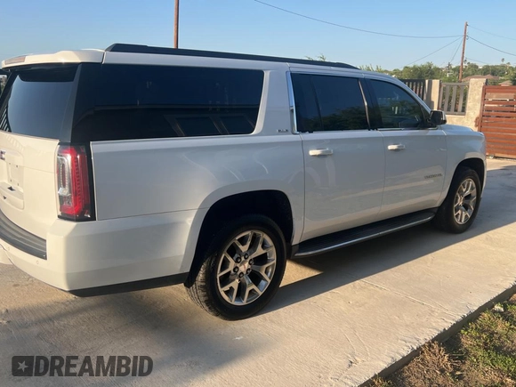 2016 GMC Yukon XL SLE with VIN 1GKS1FKC4GR126775, listed as a Copart auction lot 52828325 with 110,002 mi miles and Clean Title. Bid and sale history available at carsss.com. Image 4.