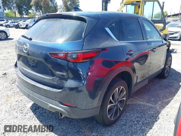 2023 Mazda CX-5 S Premium with VIN JM3KFBDM4P0185865, listed as a IAAI auction lot 42040234 with 32,761 mi miles and . Bid and sale history available at DreamBid. Image 4.