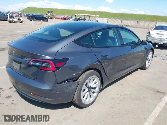 2022 Tesla Model 3 with VIN 5YJ3E1EA6NF144098, listed as a IAAI auction lot 41965360 with 75,597 mi miles. Bid and sale history available at carsss.com. Image 6.