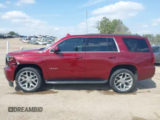 2019 Chevrolet Tahoe LT z VIN 1GNSCBKC9KR102552, wystawiony jako IAAI lot #41792517 z przebiegiem 92 856 mil mil oraz . Historia ofert i sprzedaży dostępna na DreamBid. Obrazek 14.