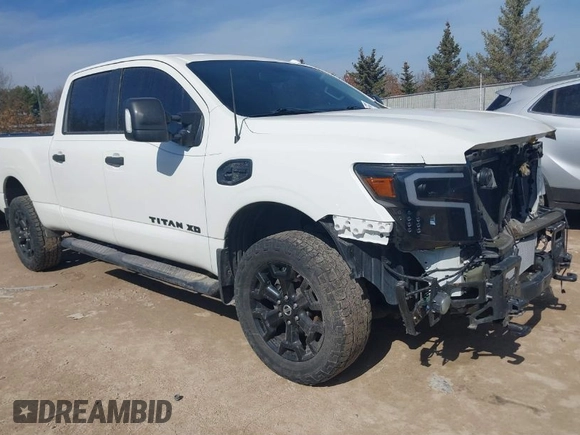 2018 Nissan Titan XD SV with VIN 1N6BA1F40JN523851, listed as a IAAI auction lot 41800730 with 104,527 mi miles. Bid and sale history available at carsss.com. Image 1.
