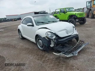2013 Volkswagen Beetle 2.5L w/Sun/Sound/Nav with VIN 3VWJX7ATXDM610778, listed as a IAAI auction lot 41893804 with Not Provided miles and . Bid and sale history available at DreamBid. Image 1.