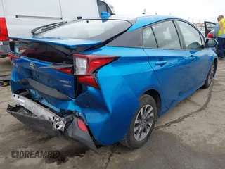 2020 Toyota Prius L Eco z VIN JTDKARFU9L3104395, wystawiony jako IAAI lot #42207156 z przebiegiem 85 572 mil mil oraz . Historia ofert i sprzedaży dostępna na DreamBid. Obrazek 4.
