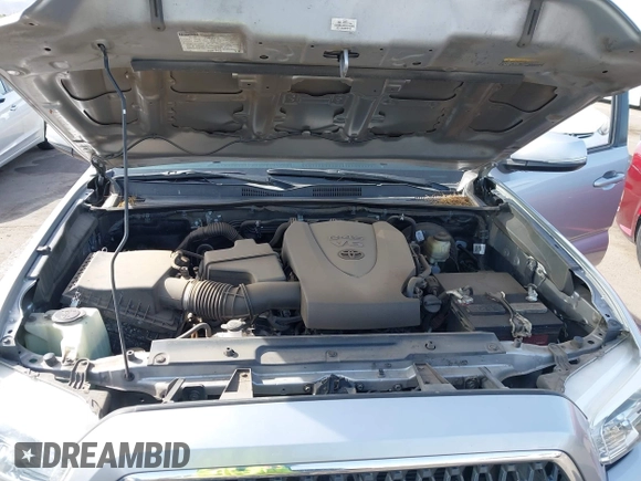 2018 Toyota Tacoma SR5 with VIN 3TMAZ5CN0JM053861, listed as a IAAI auction lot 41920377 with 104,015 mi miles and . Bid and sale history available at DreamBid. Image 10.