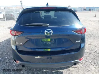 2017 Mazda CX-5 Touring with VIN JM3KFACL5H0180243, listed as a IAAI auction lot 41990818 with 158,977 mi miles. Bid and sale history available at carsss.com. Image 16.