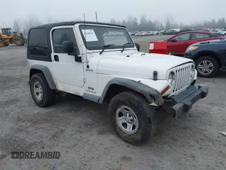 2006 Jeep Wrangler Sport Right Hand Drive with VIN 1J4F449S16P709895, listed as a IAAI auction lot 41349311 with 157,125 mi miles. Bid and sale history available at carsss.com. Image 1.