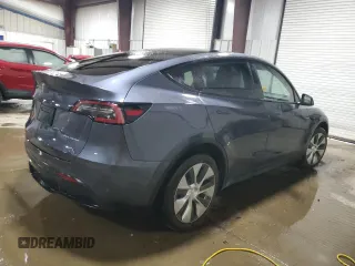 2022 Tesla Model Y Long Range with VIN 7SAYGDEE7NF422837, listed as a Copart auction lot 55271665 with 52,976 mi miles and Clean Title. Bid and sale history available at DreamBid. Image 3.