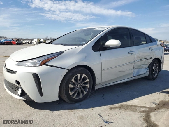 2021 Toyota Prius L Eco with VIN JTDKAMFU5M3133915, listed as a Copart auction lot 47015075 with 56,133 mi miles and Salvage Title. Bid and sale history available at carsss.com. Image 1.