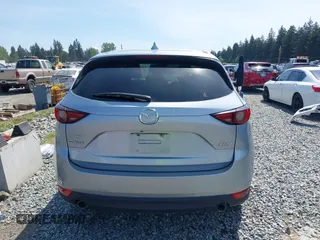 2018 Mazda CX-5 Grand Touring z VIN JM3KFADM7J0318684, wystawiony jako IAAI lot #42226937 z przebiegiem 69 166 mil mil oraz . Historia ofert i sprzedaży dostępna na DreamBid. Obrazek 16.