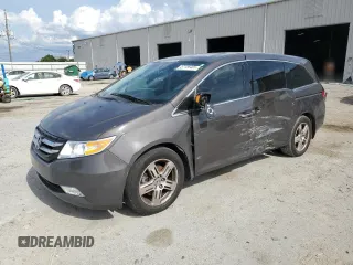 2013 Honda Odyssey Touring with VIN 5FNRL5H95DB031704, listed as a Copart auction lot 57156405 with 132,187 mi miles and Salvage title. Bid and sale history available at DreamBid. Image 1.