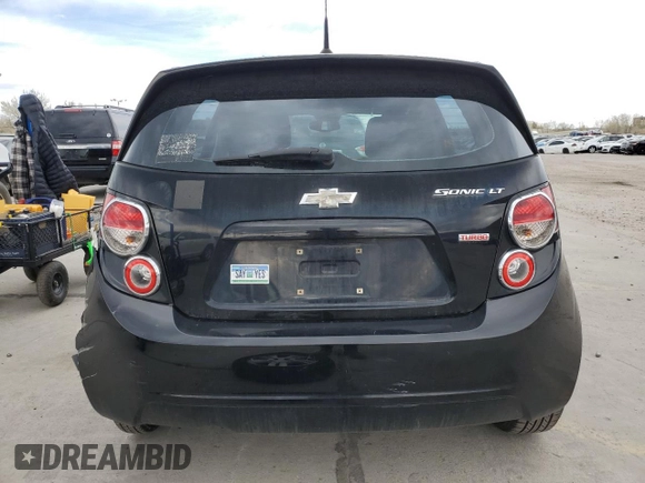 2012 Chevrolet Sonic LT with VIN 1G1JC6SB7C4200604, listed as a Copart auction lot 52843945 with 101,039 mi miles and Salvage Title. Bid and sale history available at carsss.com. Image 6.
