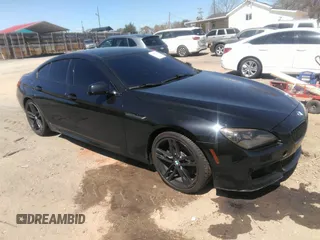 2014 BMW 6 Series 640i z VIN WBA6A0C57EDZ04682, wystawiony jako IAAI lot #41891362 z przebiegiem 140 478 mil mil oraz . Historia ofert i sprzedaży dostępna na DreamBid. Obrazek 1.