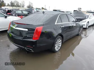 2014 Cadillac CTS Luxury AWD with VIN 1G6AX5SX3E0156938, listed as a IAAI auction lot 41574318 with 151,585 mi miles and . Bid and sale history available at DreamBid. Image 4.