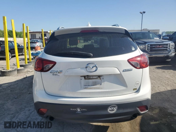 2016 Mazda CX-5 Touring z VIN JM3KE2CYXG0683673, wystawiony jako Copart lot #56724025 z przebiegiem 107 293 mil mil oraz Szkoda całkowita • Salvage title. Historia ofert i sprzedaży dostępna na DreamBid. Obrazek 6.