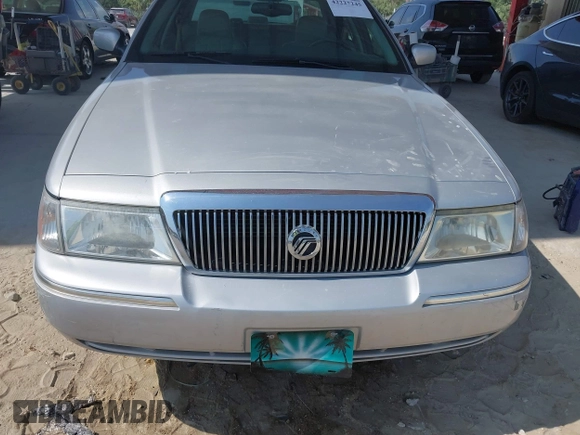 2003 Mercury Grand Marquis LS Premium z VIN 2MEFM75W83X631023, wystawiony jako IAAI lot #42227245 z przebiegiem 114 235 mil mil oraz . Historia ofert i sprzedaży dostępna na DreamBid. Obrazek 6.