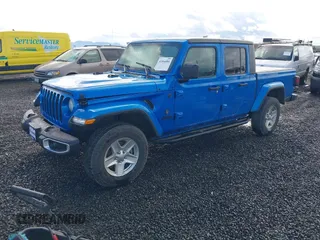 2022 Jeep Gladiator Willys z VIN 1C6JJTAM4NL130350, wystawiony jako IAAI lot #41964484 z przebiegiem Nie podano mil oraz . Historia ofert i sprzedaży dostępna na DreamBid. Obrazek 2.