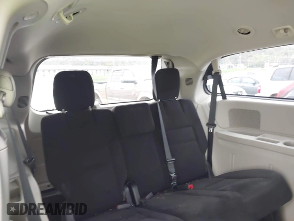 2014 Dodge Grand Caravan SXT with VIN 2C4RDGCG0ER417662, listed as a IAAI auction lot 41933279 with 156,751 mi miles and . Bid and sale history available at DreamBid. Image 17.