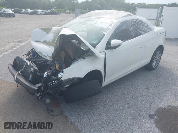 2012 Volkswagen Eos Komfort with VIN WVWBW7AH9CV017620, listed as a IAAI auction lot 40945479 with 96,444 mi miles and . Bid and sale history available at DreamBid. Image 2.