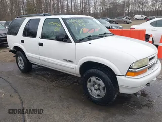 2003 Chevrolet Blazer LS z VIN 1GNDT13X33K129132, wystawiony jako IAAI lot #40646211 z przebiegiem 172 832 mil mil oraz . Historia ofert i sprzedaży dostępna na DreamBid. Obrazek 1.