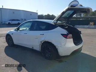 2023 Tesla Model Y Performance with VIN 7SAYGDEF3PF711497, listed as a IAAI auction lot 41877450 with 21,887 mi miles and . Bid and sale history available at DreamBid. Image 3.