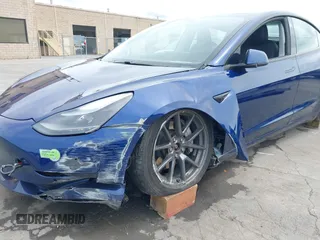 2021 Tesla Model 3 Long Range with VIN 5YJ3E1EB6MF878411, listed as a IAAI auction lot 41986947 with 71,978 mi miles and . Bid and sale history available at DreamBid. Image 6.