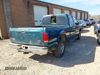 1999 Ford Super Duty F-250 XL with VIN 1FTNW21S2XEE10313, listed as a IAAI auction lot 41825300 with 150,619 mi miles. Bid and sale history available at carsss.com. Image 4.