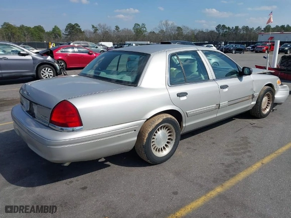 2004 Ford Crown Victoria Standard with VIN 2FAFP73W94X107561, listed as a IAAI auction lot 41804985 with 128,066 mi miles. Bid and sale history available at carsss.com. Image 4.
