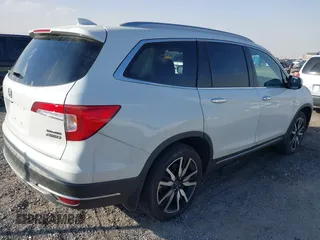 2022 Honda Pilot Touring 7-Passenger with VIN 5FNYF6H67NB017660, listed as a IAAI auction lot 41194603 with 87,301 mi miles. Bid and sale history available at carsss.com. Image 4.