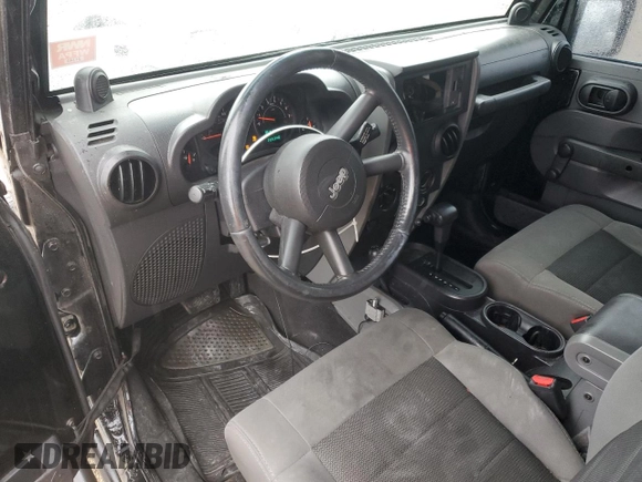 2008 Jeep Wrangler X z VIN 1J8FA24168L646281, wystawiony jako Copart lot #57689895 z przebiegiem 205 348 mil mil oraz Szkoda całkowita • Salvage title. Historia ofert i sprzedaży dostępna na DreamBid. Obrazek 8.