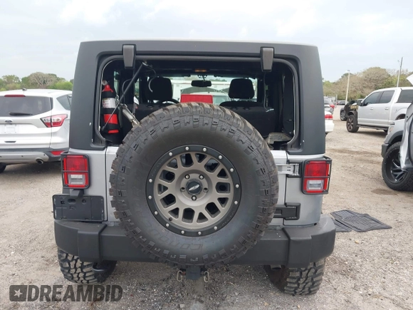 2014 Jeep Wrangler Sport with VIN 1C4AJWAG0EL265409, listed as a IAAI auction lot 41726935 with 78,547 mi miles and . Bid and sale history available at DreamBid. Image 17.