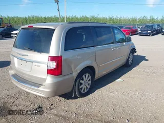 2013 Chrysler Town & Country Touring with VIN 2C4RC1BG7DR621665, listed as a IAAI auction lot 42133109 with 135,898 mi miles and . Bid and sale history available at DreamBid. Image 4.