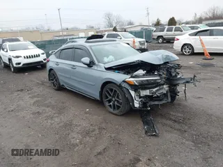 2023 Honda Civic Sport Touring z VIN 19XFL1G89PE005976, wystawiony jako IAAI lot #41668302 z przebiegiem Nie podano mil oraz . Historia ofert i sprzedaży dostępna na DreamBid. Obrazek 1.