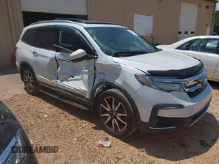 2022 Honda Pilot Touring 8-Passenger with VIN 5FNYF5H96NB004676, listed as a IAAI auction lot 42636581 with 23,428 mi miles and . Bid and sale history available at DreamBid. Image 1.