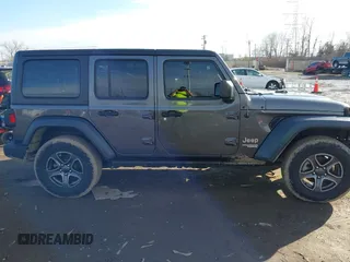 2018 Jeep Wrangler Unlimited Sport S with VIN 1C4HJXDN0JW255003, listed as a IAAI auction lot 41528394 with 55,660 mi miles and . Bid and sale history available at DreamBid. Image 14.