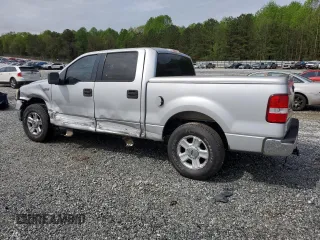 2005 Ford F-150 XLT with VIN 1FTRW12WX5FA79128, listed as a Copart auction lot 51963585 with 169,045 mi miles and Salvage Title. Bid and sale history available at carsss.com. Image 2.