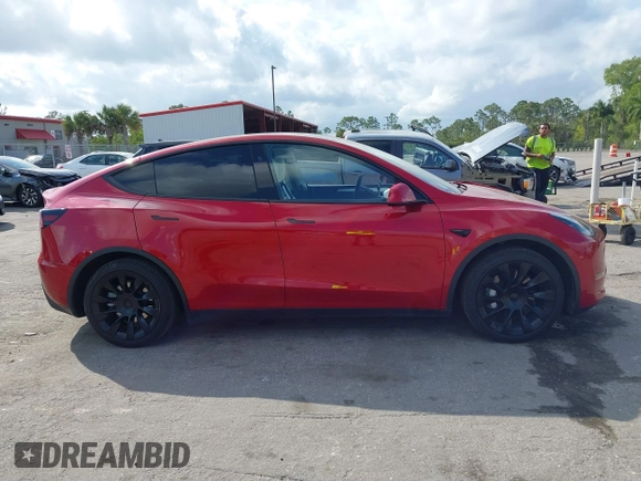 2023 Tesla Model Y Long Range with VIN 7SAYGDEE1PA154996, listed as a IAAI auction lot 41472595 with 24,861 mi miles and . Bid and sale history available at DreamBid. Image 13.