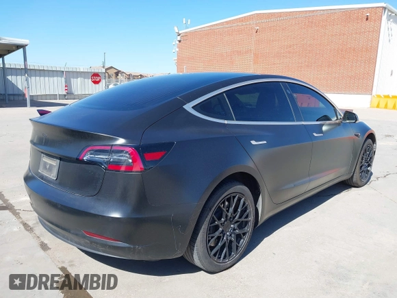2020 Tesla Model 3 Standard Range Plus with VIN 5YJ3E1EA0LF597761, listed as a IAAI auction lot 41773918 with 89,957 mi miles. Bid and sale history available at carsss.com. Image 4.