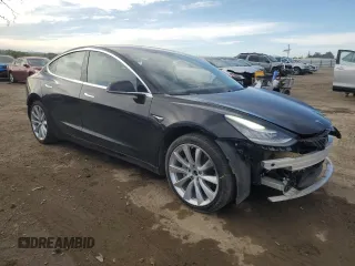 2019 Tesla Model 3 Long Range with VIN 5YJ3E1EB1KF212019, listed as a Copart auction lot 50134385 with 83,478 mi miles and Salvage Title. Bid and sale history available at DreamBid. Image 4.
