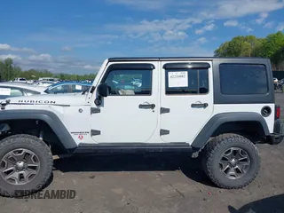 2014 Jeep Wrangler Unlimited Rubicon X with VIN 1C4BJWFG6EL240849, listed as a IAAI auction lot 42216082 with 118,912 mi miles and . Bid and sale history available at DreamBid. Image 14.