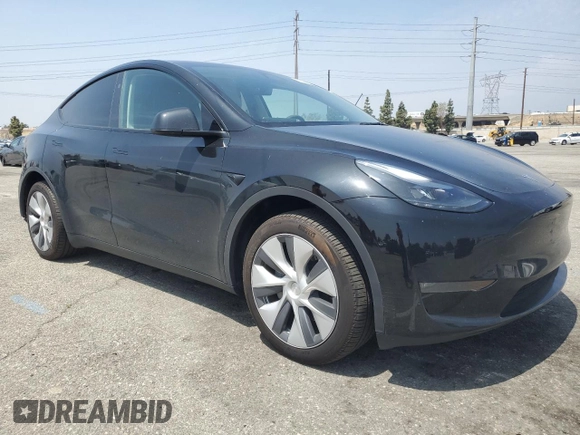 2024 Tesla Model Y Long Range with VIN 7SAYGDEE4RA228916, listed as a Copart auction lot 54921575 with 13,607 mi miles and Salvage title. Bid and sale history available at DreamBid. Image 4.