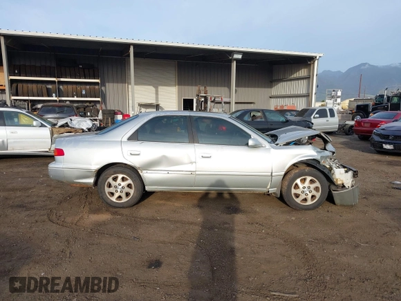 2000 Toyota Camry LE z VIN JT2BF28K6Y0282836, wystawiony jako IAAI lot #41799376 z przebiegiem 210 710 mil mil oraz . Historia ofert i sprzedaży dostępna na DreamBid. Obrazek 13.