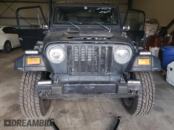 2004 Jeep Wrangler Sport z VIN 1J4FA49S44P746039, wystawiony jako Copart lot #51982795 z przebiegiem Nie podano mil oraz Czysty tytuł • Clean title. Historia ofert i sprzedaży dostępna na DreamBid. Obrazek 5.