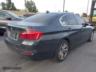 2015 BMW 5 Series 528i with VIN WBA5A5C55FD521110, listed as a IAAI auction lot 41614593 with 70,727 mi miles. Bid and sale history available at carsss.com. Image 4.
