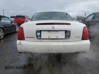 2002 Cadillac DeVille DHS z VIN 1G6KE57Y42U277428, wystawiony jako Copart lot #45757115 z przebiegiem 143 741 mil mil oraz Czysty tytuł • Clean title. Historia ofert i sprzedaży dostępna na DreamBid. Obrazek 6.