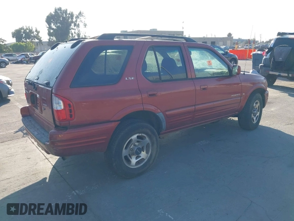 2001 Isuzu Rodeo S with VIN 4S2DM58W814303358, listed as a IAAI auction lot 42695509 with Not provided miles and . Bid and sale history available at DreamBid. Image 4.