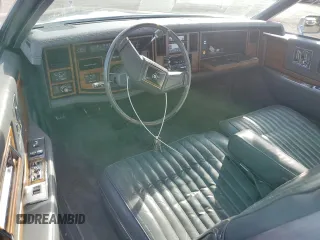 1985 Cadillac Eldorado z VIN 1G6EL5786FE628861, wystawiony jako Copart lot #76372384 z przebiegiem 15 146 mil mil oraz Szkody całkowita. Historia ofert i sprzedaży dostępna na DreamBid. Obrazek 8.