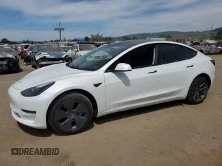 2023 Tesla Model 3 with VIN 5YJ3E1EA7PF452786, listed as a Copart auction lot 52570005 with 61,492 mi miles and Salvage title. Bid and sale history available at DreamBid. Image 1.