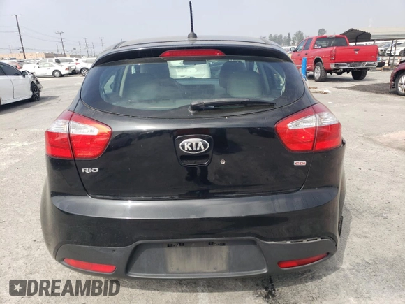 2014 Kia Rio LX with VIN KNADM5A35E6409088, listed as a Copart auction lot 75004804 with 111,664 mi miles and Salvage Title. Bid and sale history available at carsss.com. Image 6.